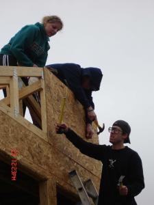 Senior Chelsey Crawford and juniors Joe Krajcik and Kevin Finn work on the roof of a house in New Orleans.